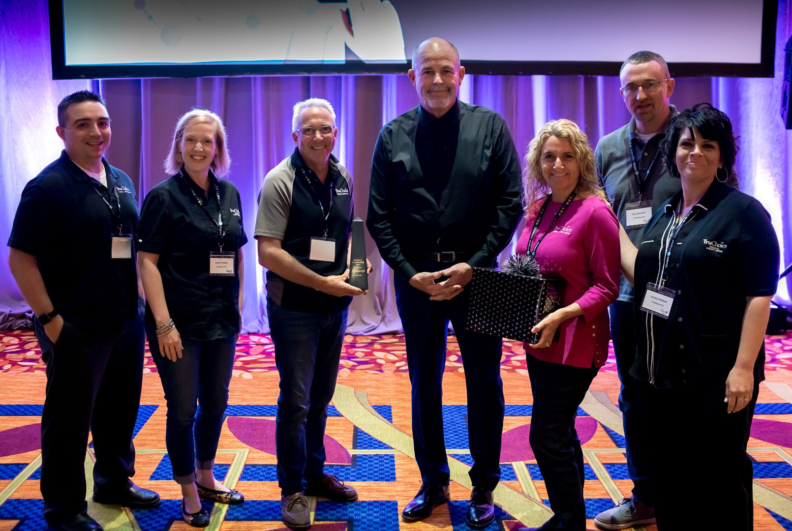 Randy stands with members of TruChoice Federal Credit Union, winner of the 2019 Spirit of CU*Answers Award.