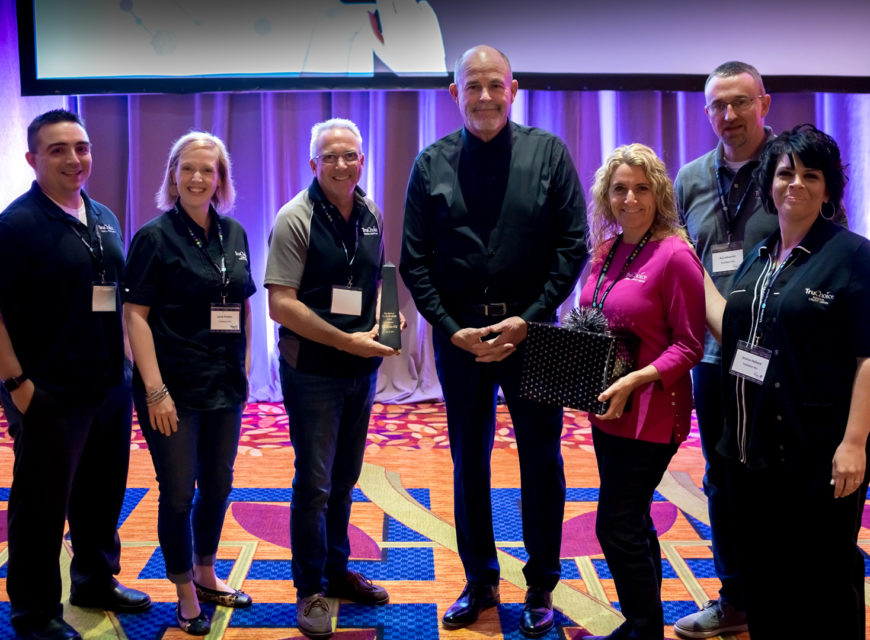 Randy stands with members of TruChoice Federal Credit Union, winner of the 2019 Spirit of CU*Answers Award.