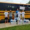 Community Pulls Together to Stuff the Bus – and Sets a Record