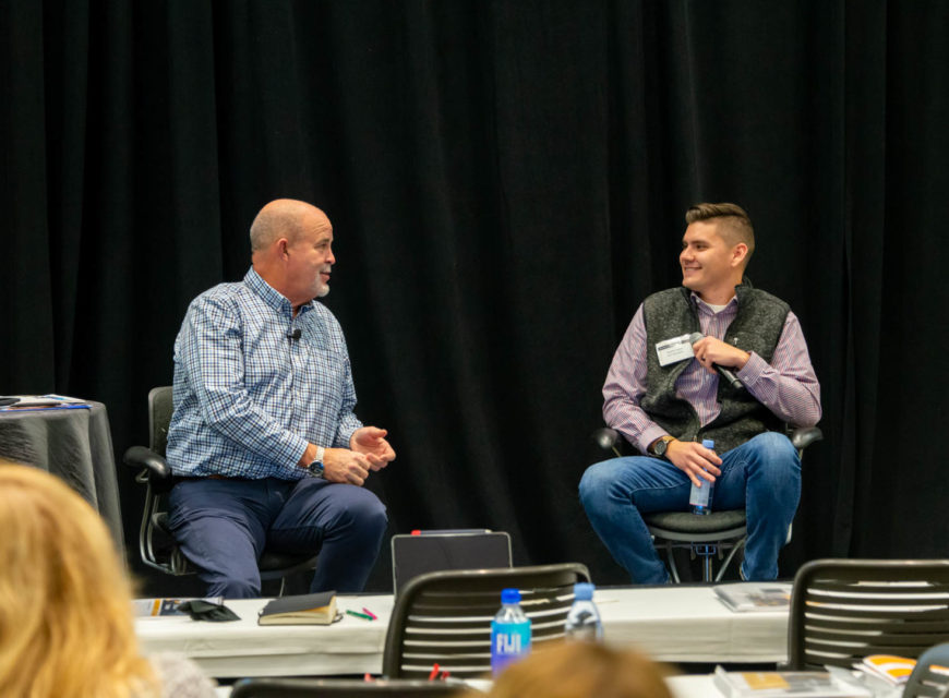 CU*Answers CEO Randy Karnes (left) is joined on stage by Charlie Dean of Lender*VP.