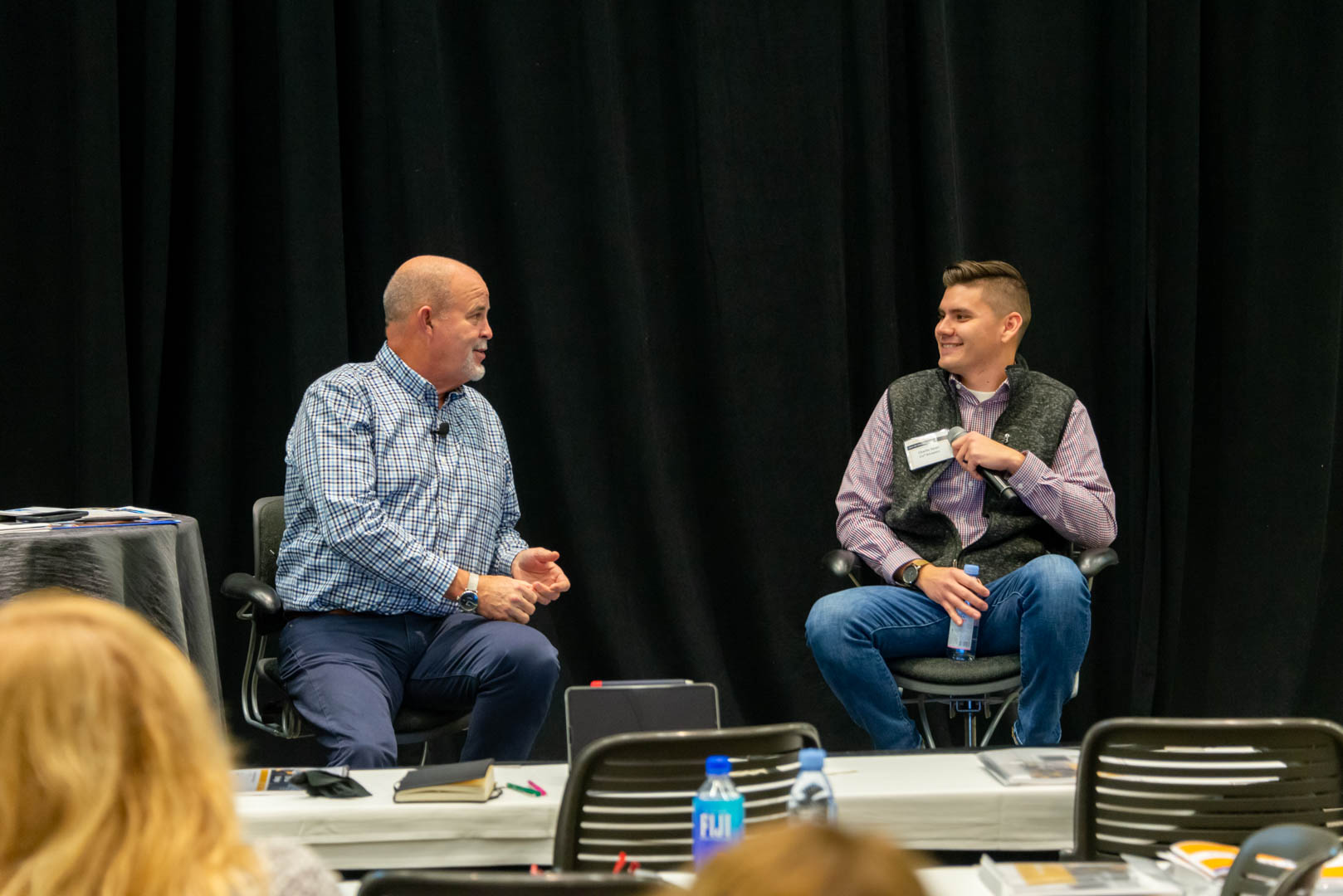 CU*Answers CEO Randy Karnes (left) is joined on stage by Charlie Dean of Lender*VP.