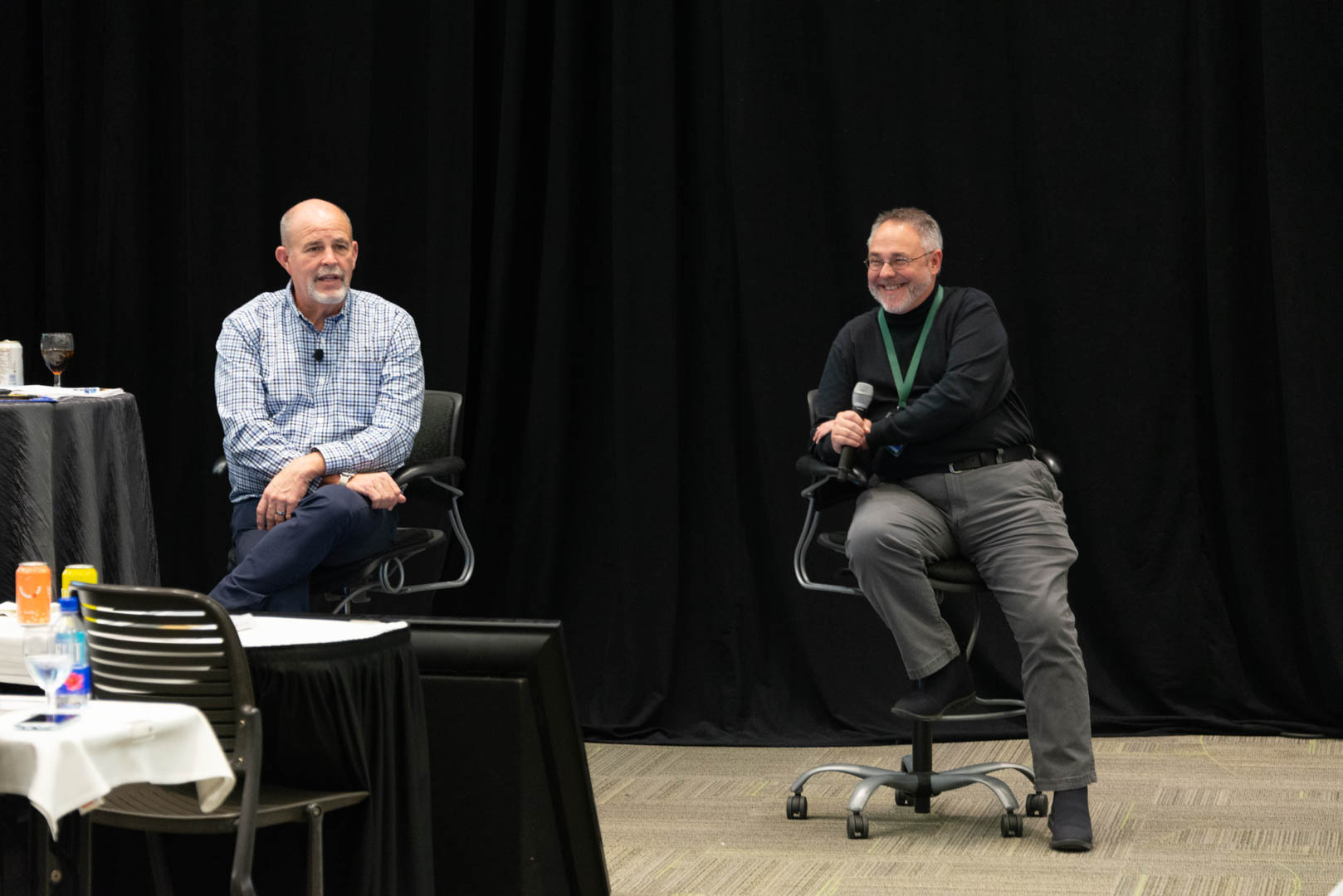 CU*Answers CEO Randy Karnes (left) is joined on stage by CU*Answers OpsEngine Business Development Manager Jeff Miller.