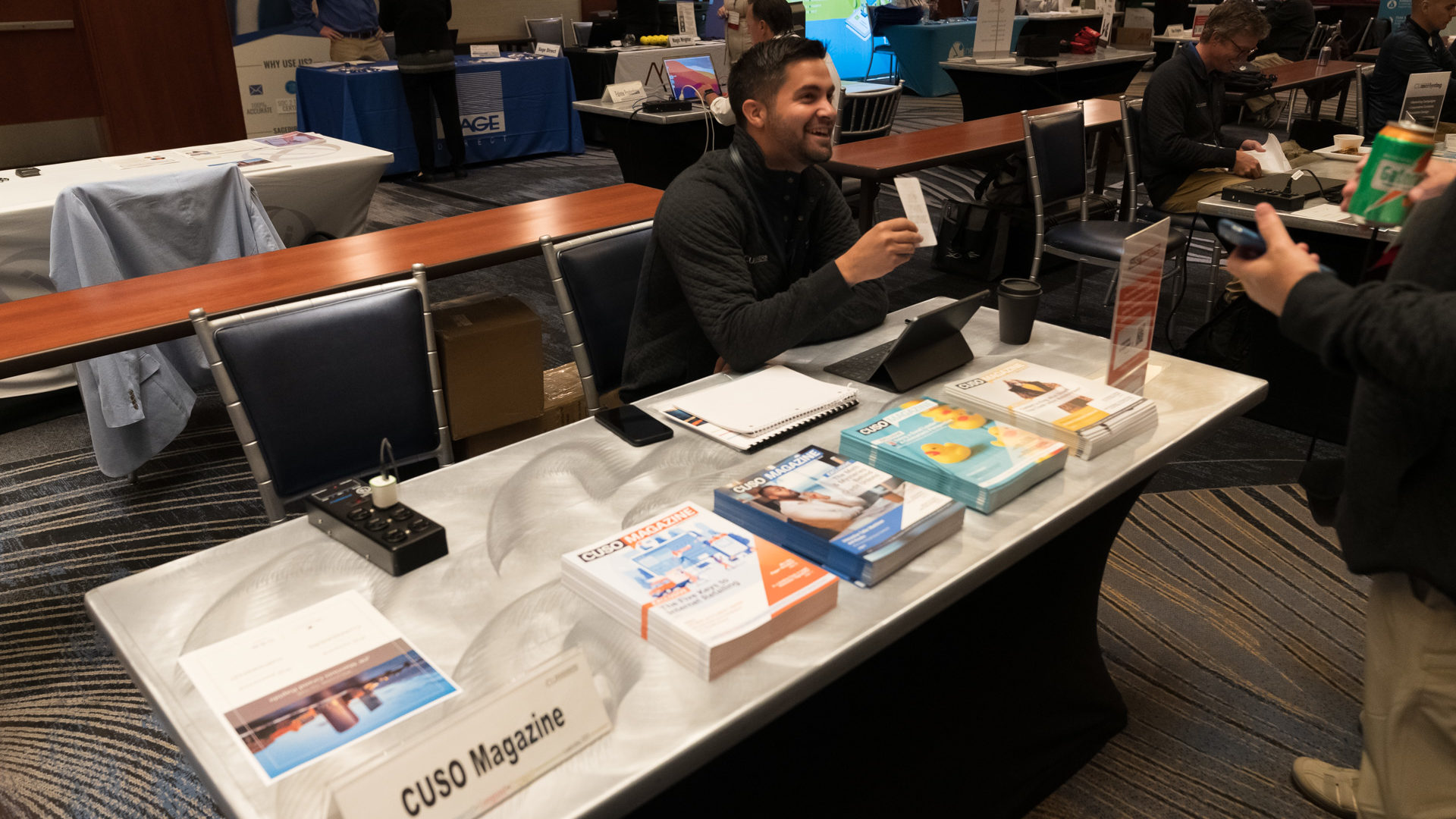 CUSO Magazine Supervising Editor Esteban Camargo speaks with attendees. 